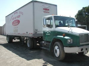 National Truck Driving School training truck parked in the yard